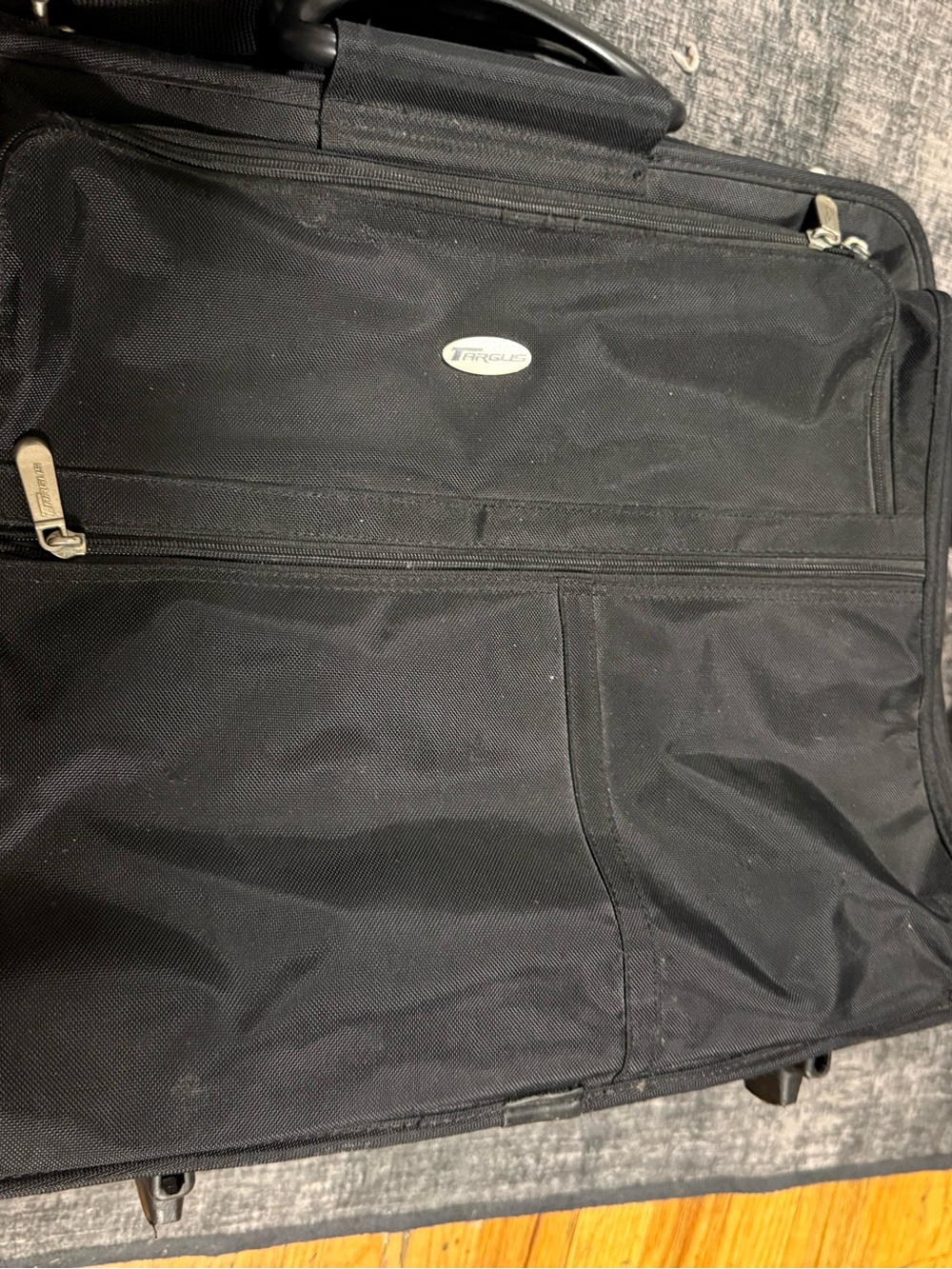 Targus rolling laptop case featuring a prominent oval brand logo